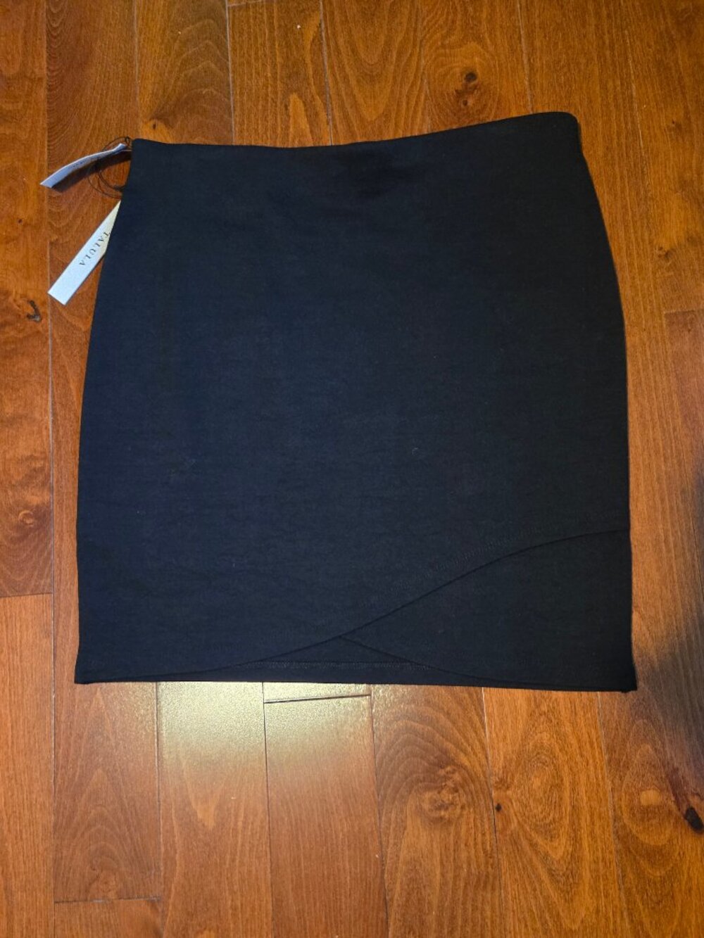 Aritzia mini skirt with layered front, size M